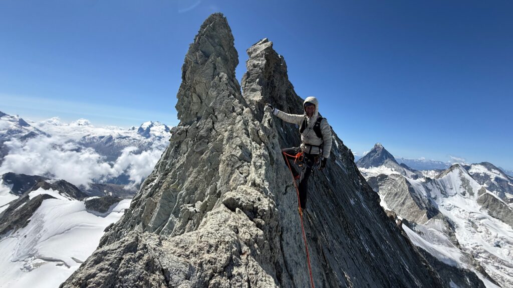Brad on the Rasoir. The rock blends in with the background so it's tough to see how narrow the Rasoir is.